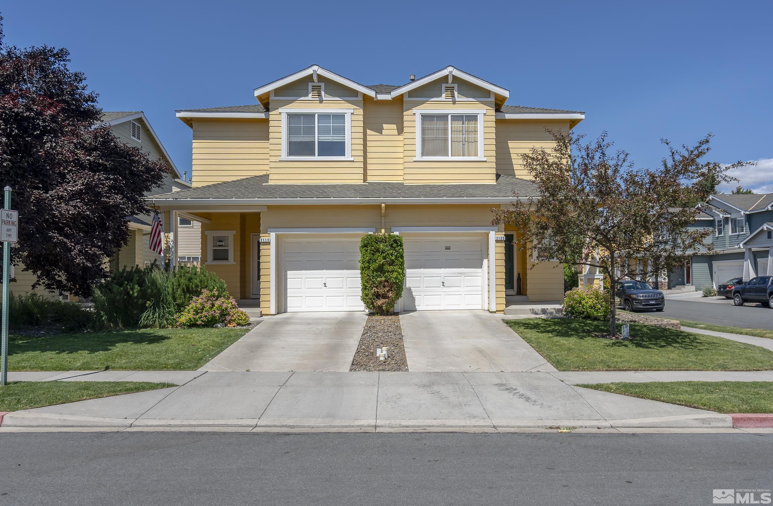 2115 Stanton Lane Reno, NV 89502 - Photo 2 of 18 a front view of a house with a yard and garage