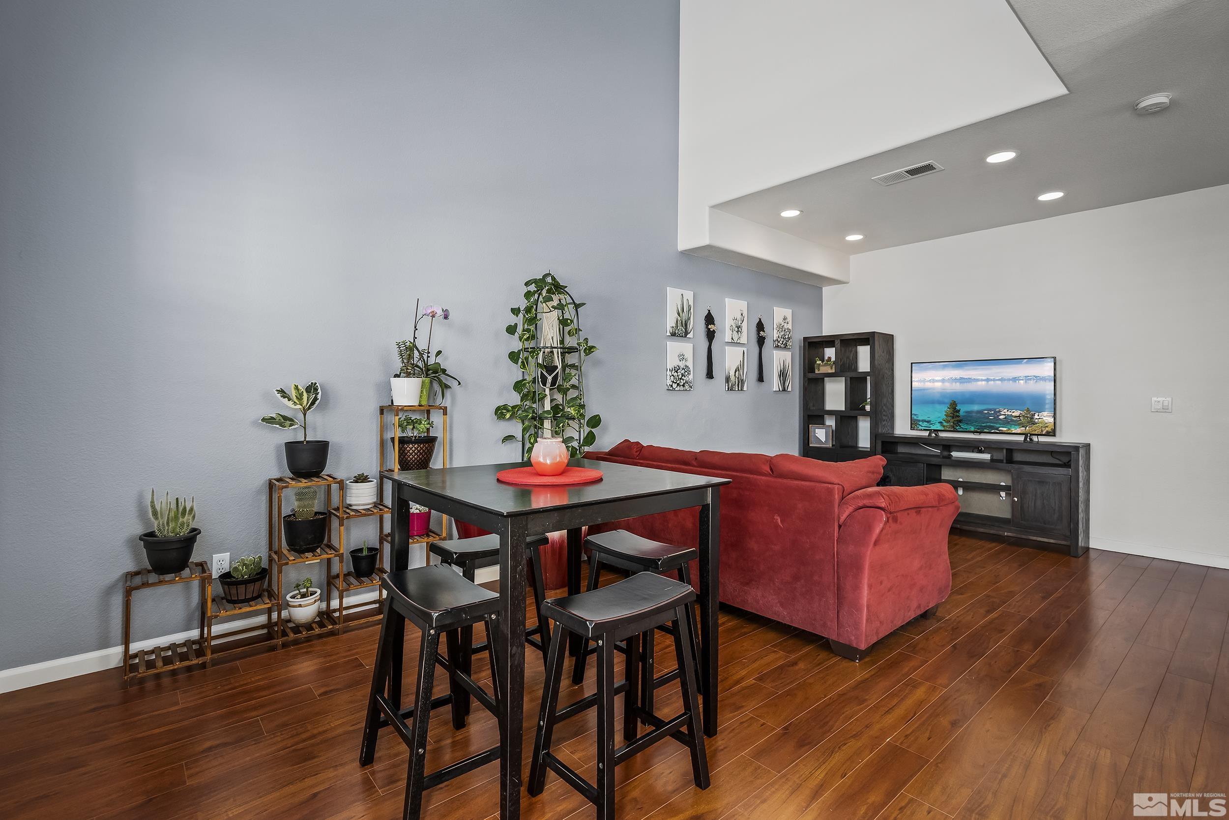 2115 Stanton Lane Reno, NV 89502 - Photo 10 of 18 a view of a dining room with furniture and wooden floor