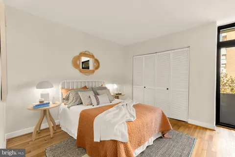 a bedroom with bed and a window