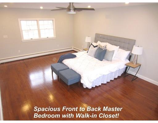 108 Pine Ridge Road Medford, MA 02155 - Photo 16 of 25 a bed sitting in a bedroom next to a window
