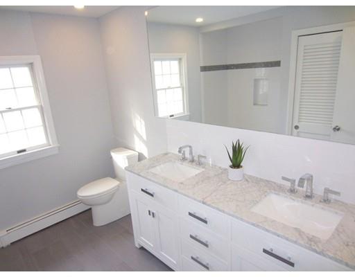 108 Pine Ridge Road Medford, MA 02155 - Photo 20 of 25 a bathroom with a granite countertop sink toilet and mirror