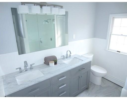 108 Pine Ridge Road Medford, MA 02155 - Photo 21 of 25 a bathroom with a granite countertop sink toilet and mirror