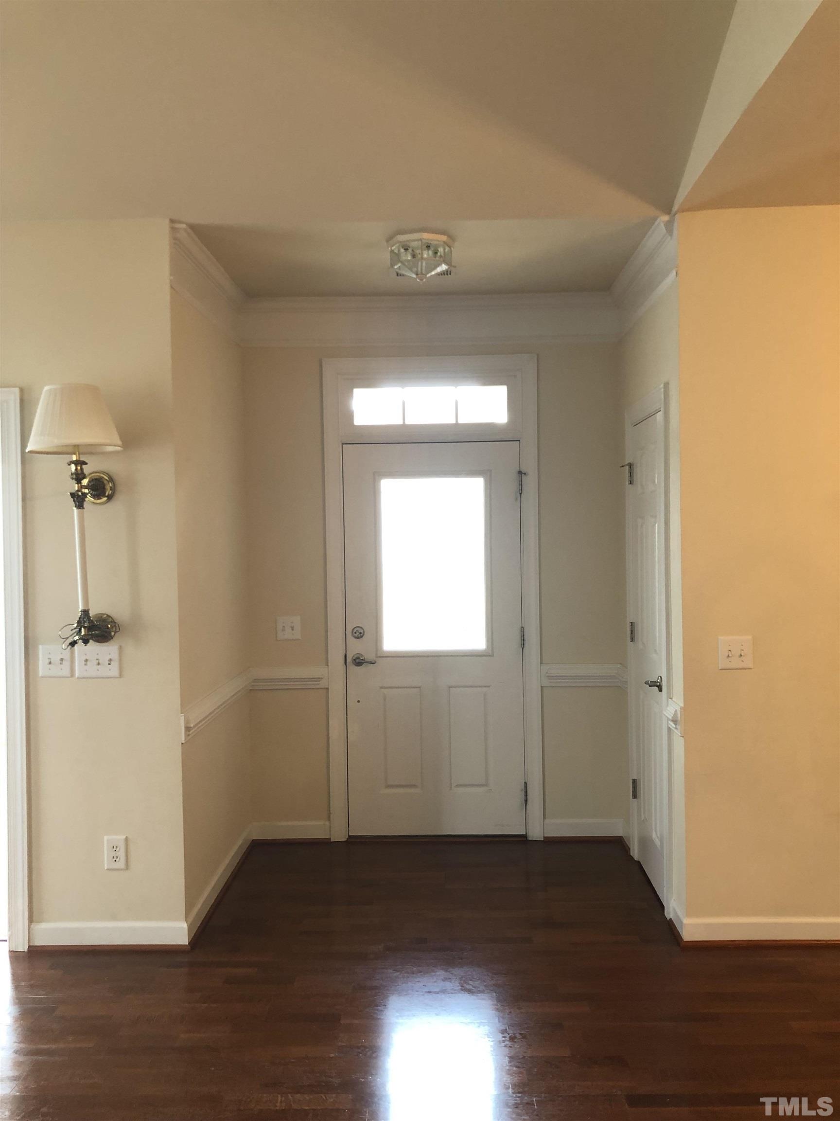 4720 Fox Fern Lane Raleigh, NC 27604 - Photo 15 of 20 a view of a hallway with wooden floor