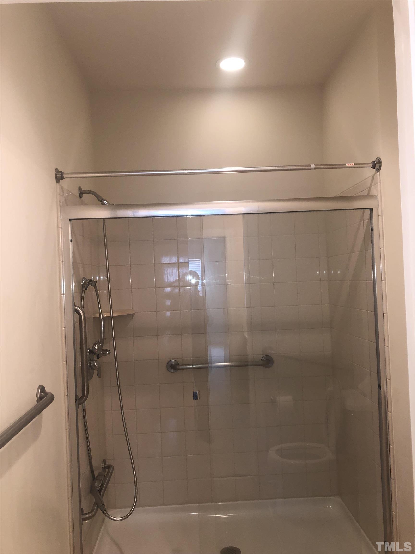 4720 Fox Fern Lane Raleigh, NC 27604 - Photo 19 of 20 a bathroom with a glass shower door