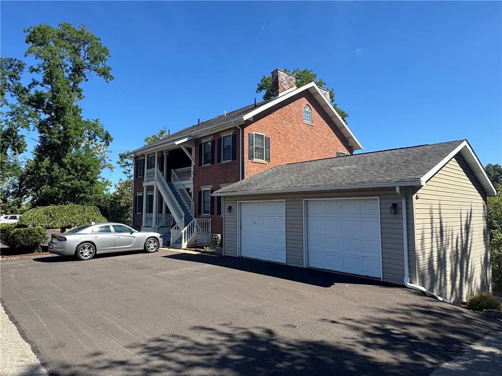 1319 Riverside Drive, Unit 200 Beaver, PA 15009 - Photo 2 of 22 Rear garage and parking area