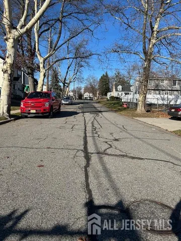 a view of street with view of house