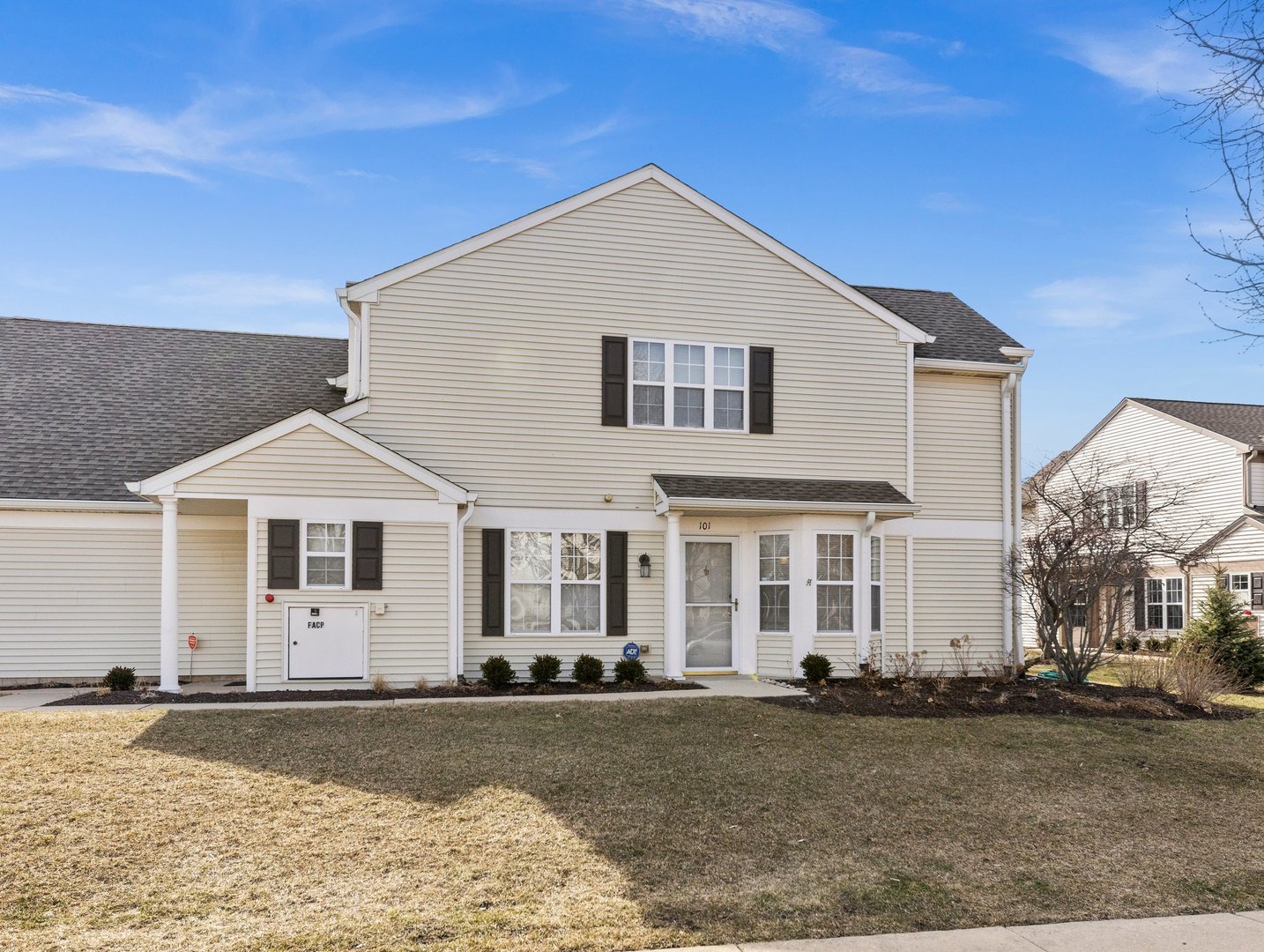 2503 Sheehan Drive, Unit 101 Naperville, IL 60564 - Photo 1 of 19 a front view of a house with a yard
