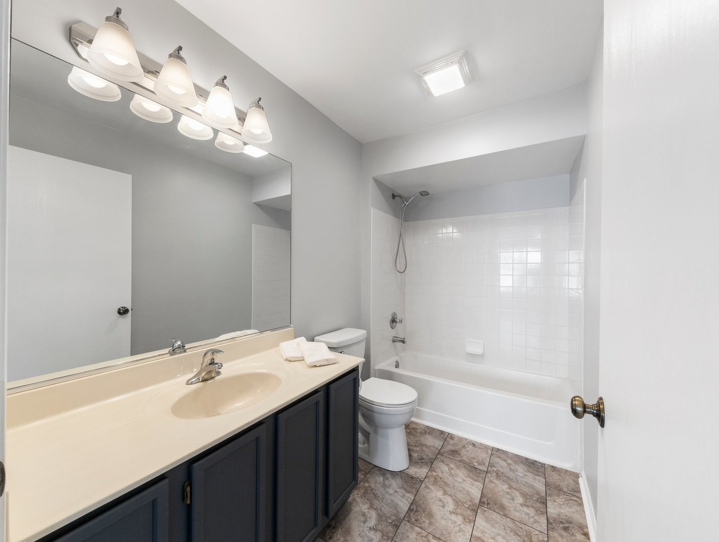 2503 Sheehan Drive, Unit 101 Naperville, IL 60564 - Photo 14 of 19 a bathroom with a double vanity sink mirror and toilet