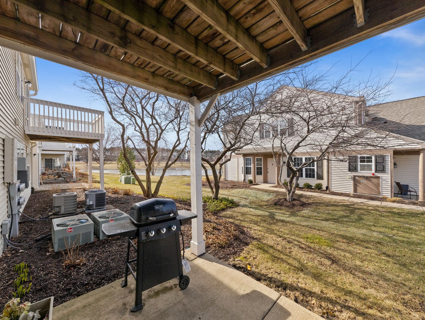 2503 Sheehan Drive, Unit 101 Naperville, IL 60564 - Photo 17 of 19 a view of a backyard with table and chairs