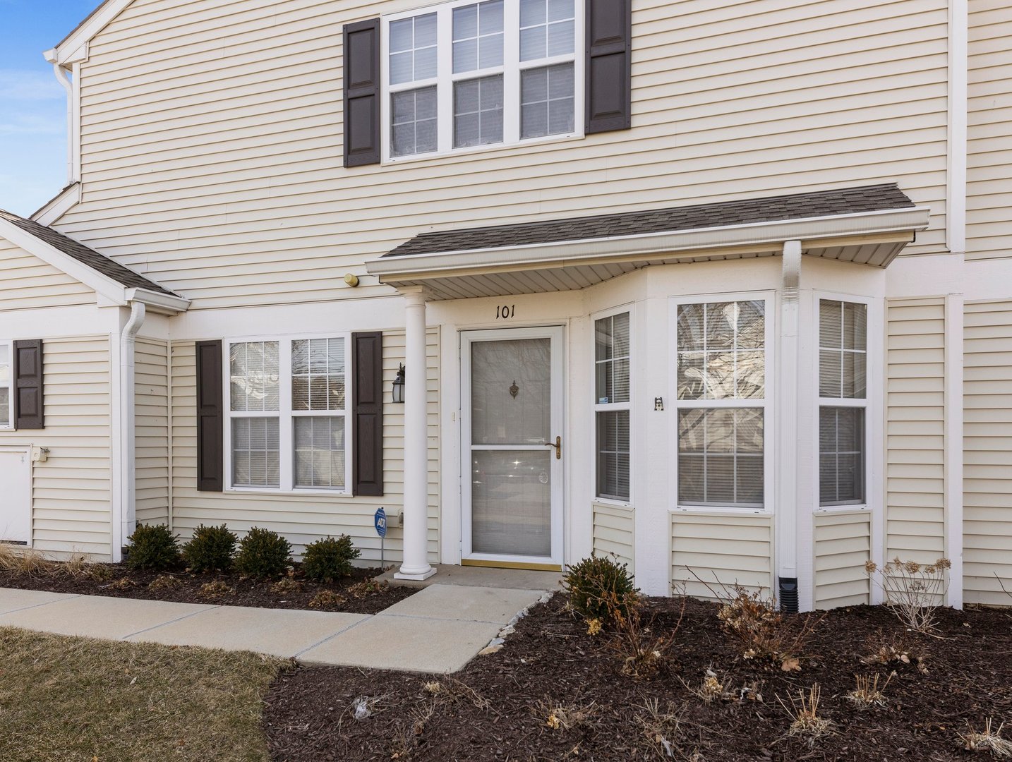 2503 Sheehan Drive, Unit 101 Naperville, IL 60564 - Photo 2 of 19 a front view of a house with garden