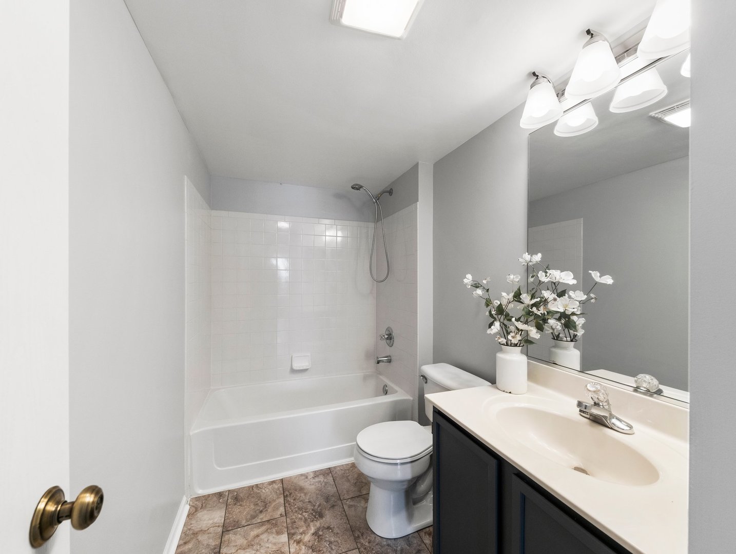 2503 Sheehan Drive, Unit 101 Naperville, IL 60564 - Photo 8 of 19 a bathroom with a sink a toilet and bathtub