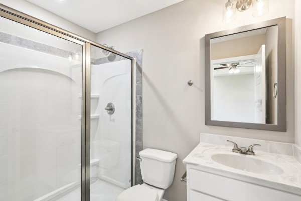 32 Echo Ridge Oak Grove, KY 42262 - Photo 13 of 42 a bathroom with a sink mirror vanity and toilet