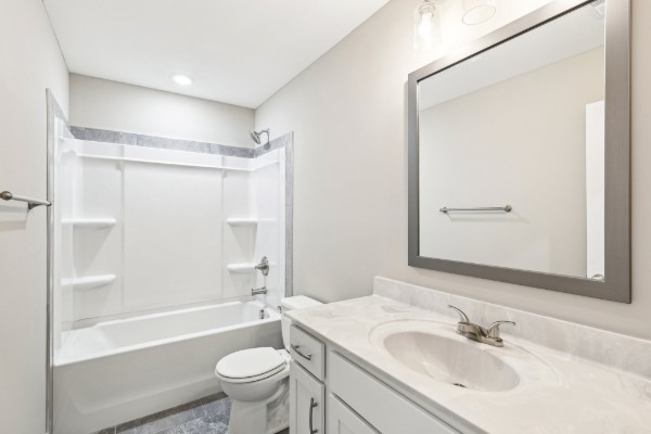 32 Echo Ridge Oak Grove, KY 42262 - Photo 18 of 42 a bathroom with a sink a toilet and a large mirror