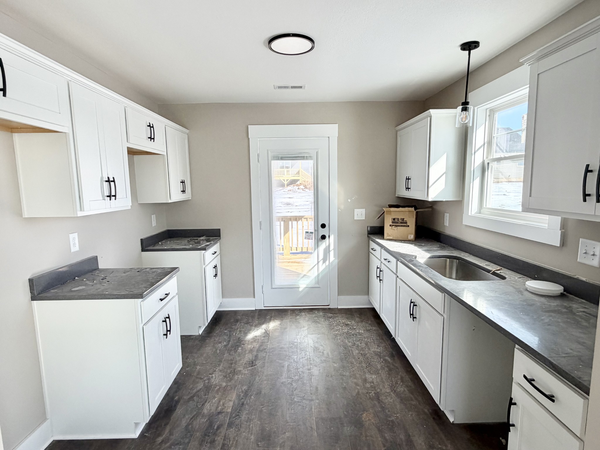 32 Echo Ridge Oak Grove, KY 42262 - Photo 32 of 42 a kitchen with granite countertop white cabinets and white appliances