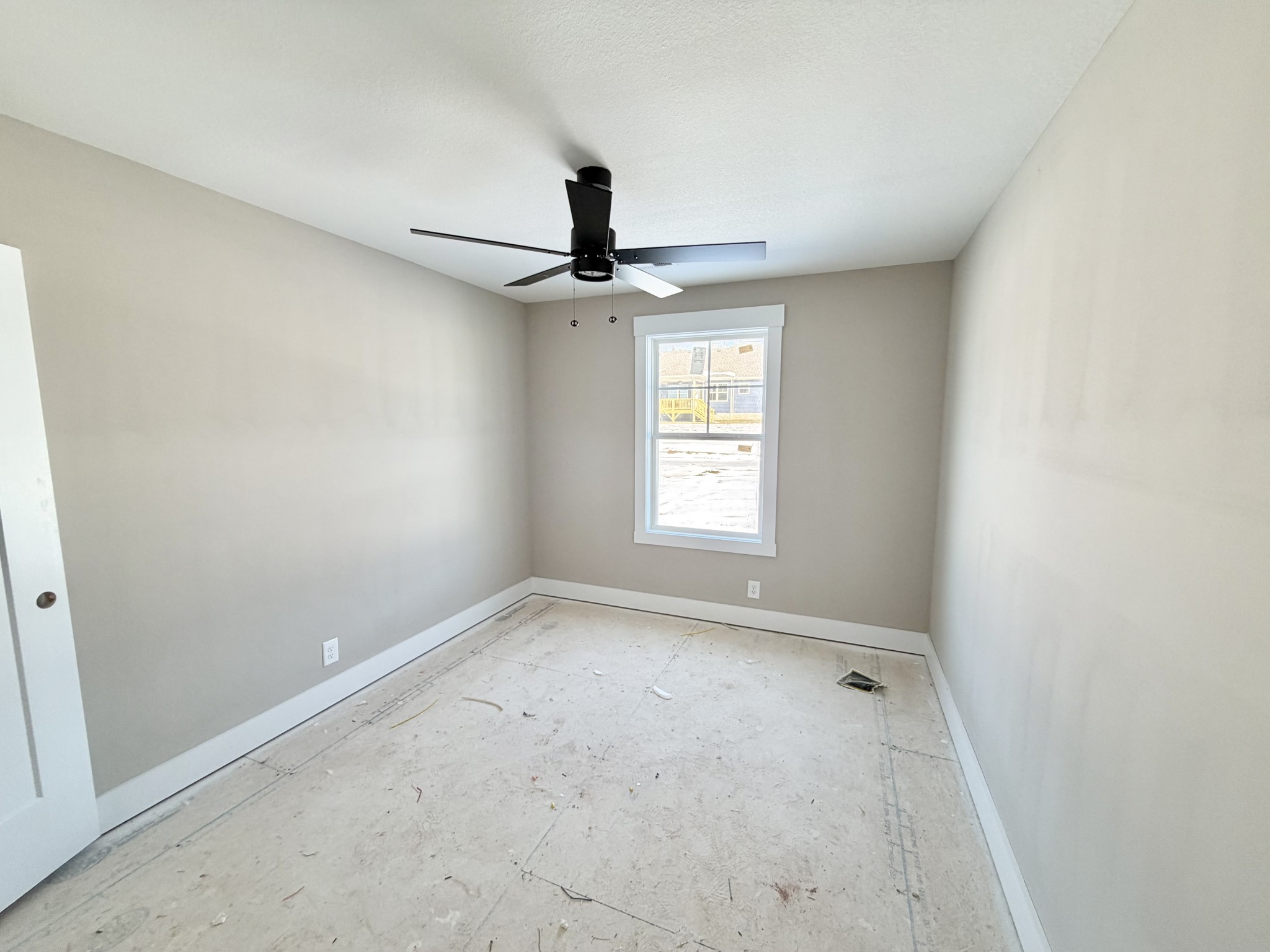32 Echo Ridge Oak Grove, KY 42262 - Photo 42 of 42 an empty room with a window and a ceiling fan