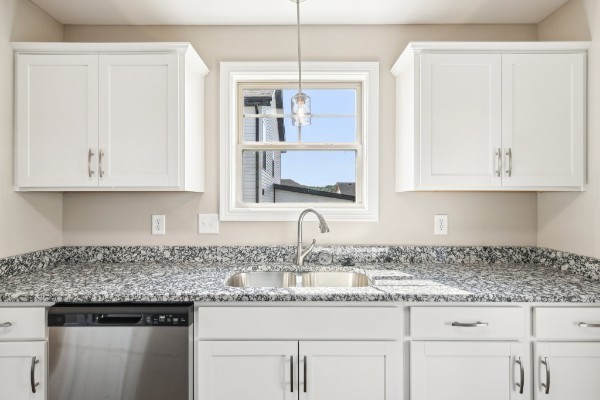 32 Echo Ridge Oak Grove, KY 42262 - Photo 8 of 42 a kitchen with granite countertop stainless steel appliances white cabinets and a sink