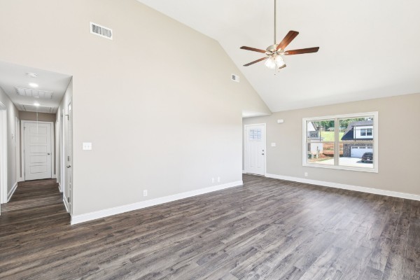 32 Echo Ridge Oak Grove, KY 42262 - Photo 10 of 42 a view of an empty room with wooden floor and a ceiling fan