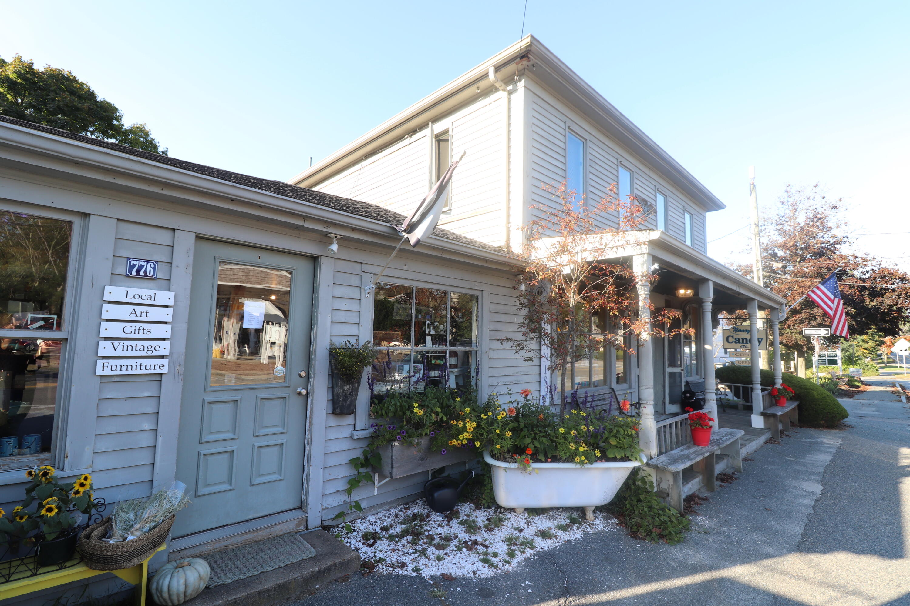6 Old Hills Road Dennis, MA 02638 - Photo 40 of 45 a view of a house with a potted plants and a fountain