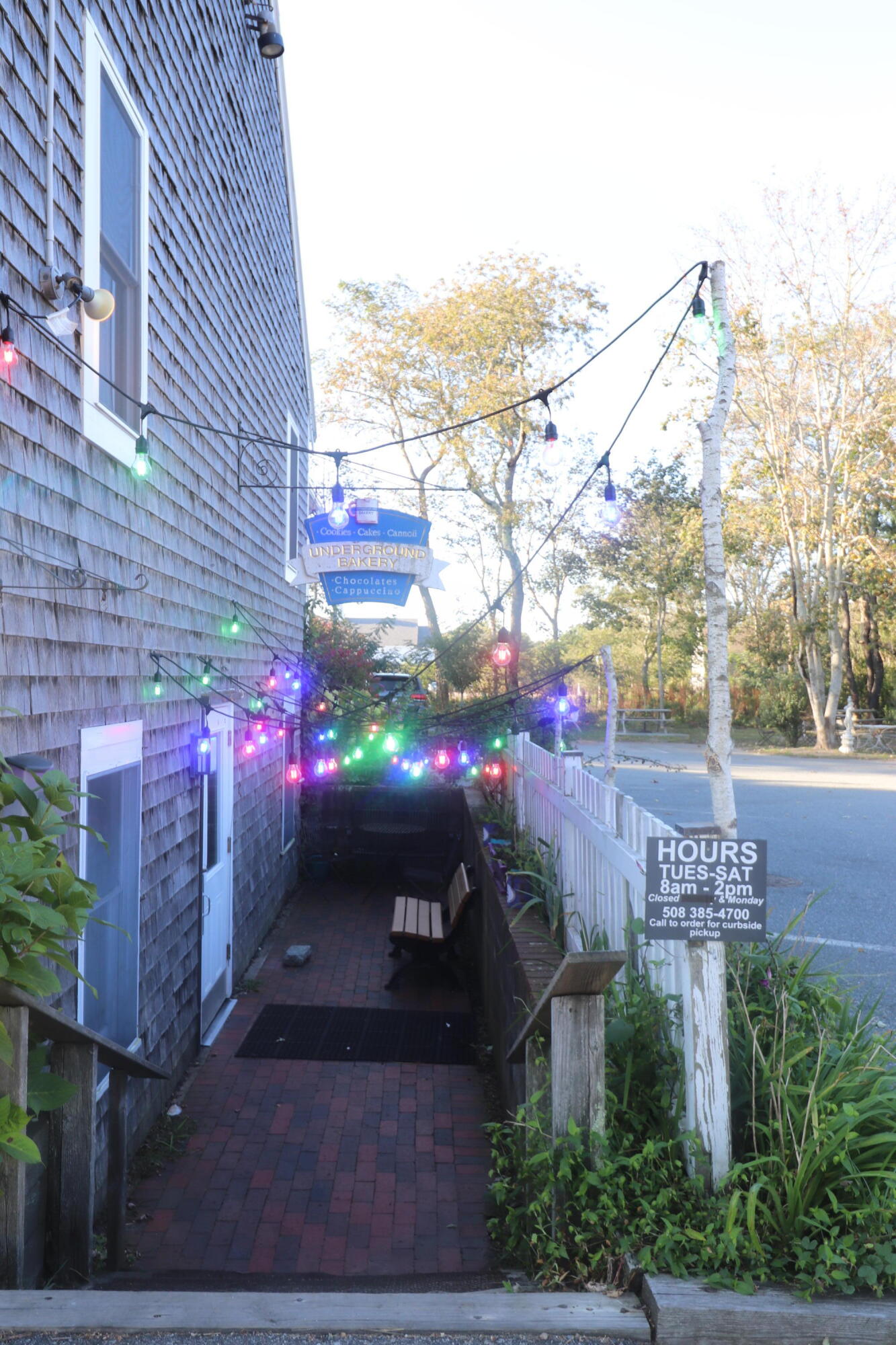 6 Old Hills Road Dennis, MA 02638 - Photo 41 of 45 a front view of a house with a yard and tree s