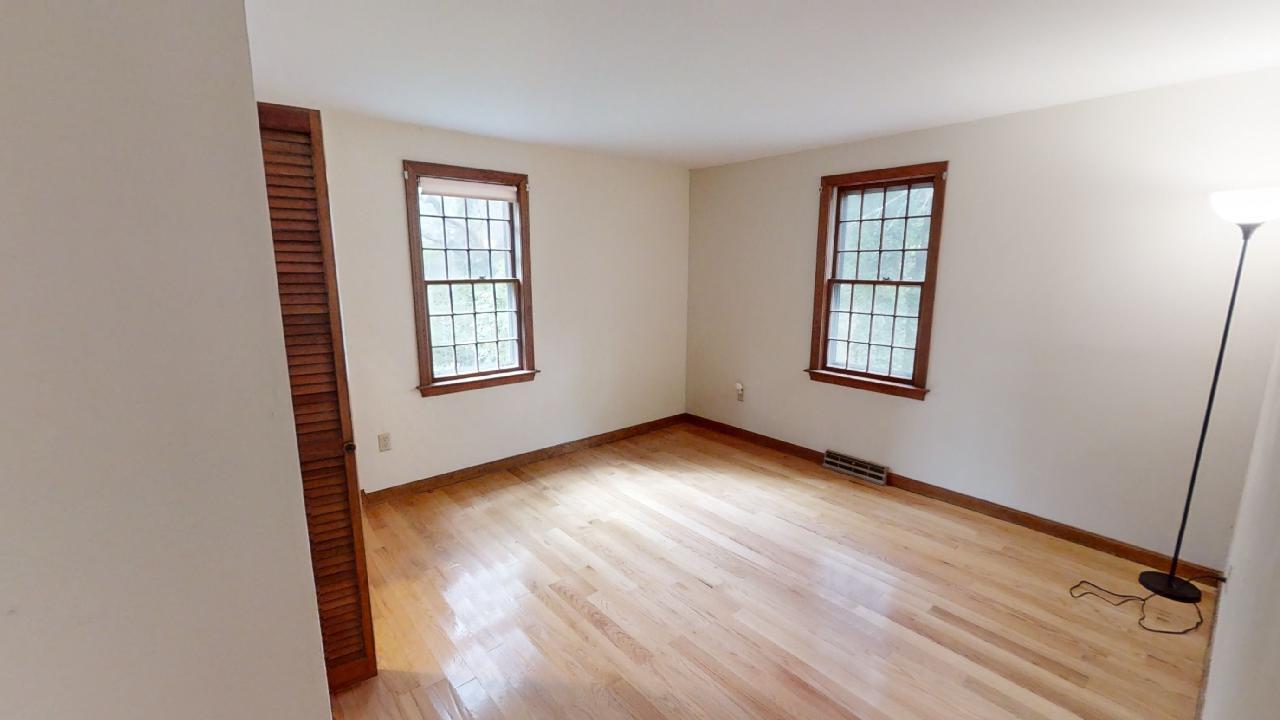 6 Old Hills Road Dennis, MA 02638 - Photo 8 of 45 an empty room with wooden floor and windows
