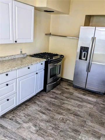 a view of room with wooden floor