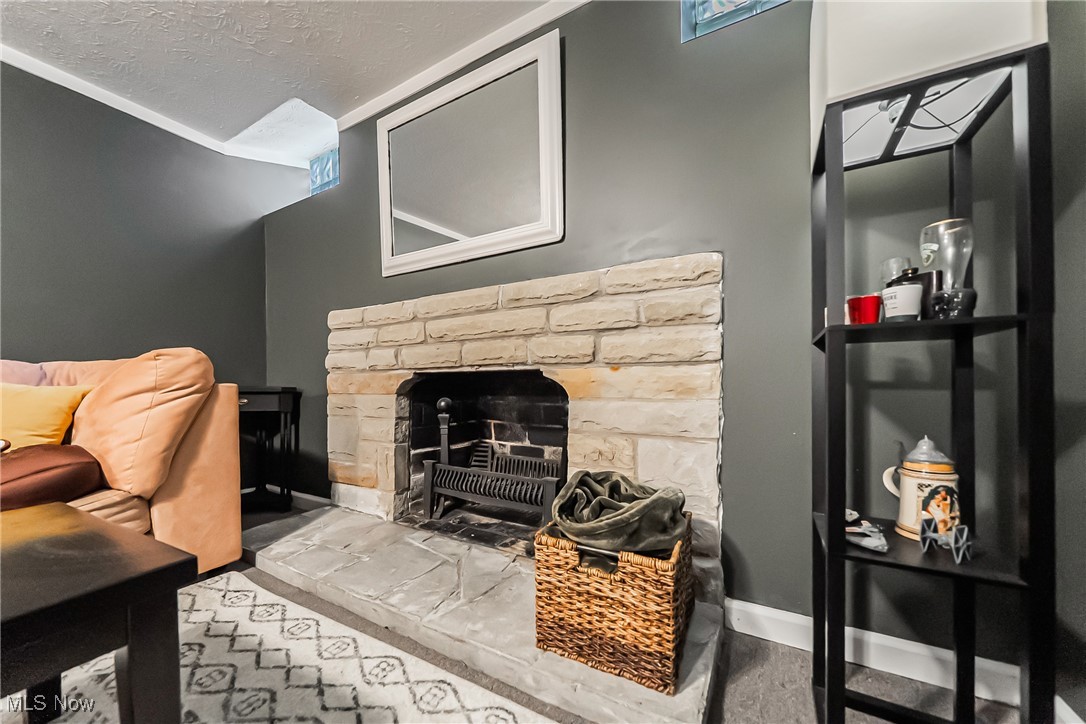 3684 Fenley Road Cleveland Heights, OH 44121 - Photo 25 of 38 Living area with a fireplace and a textured ceiling