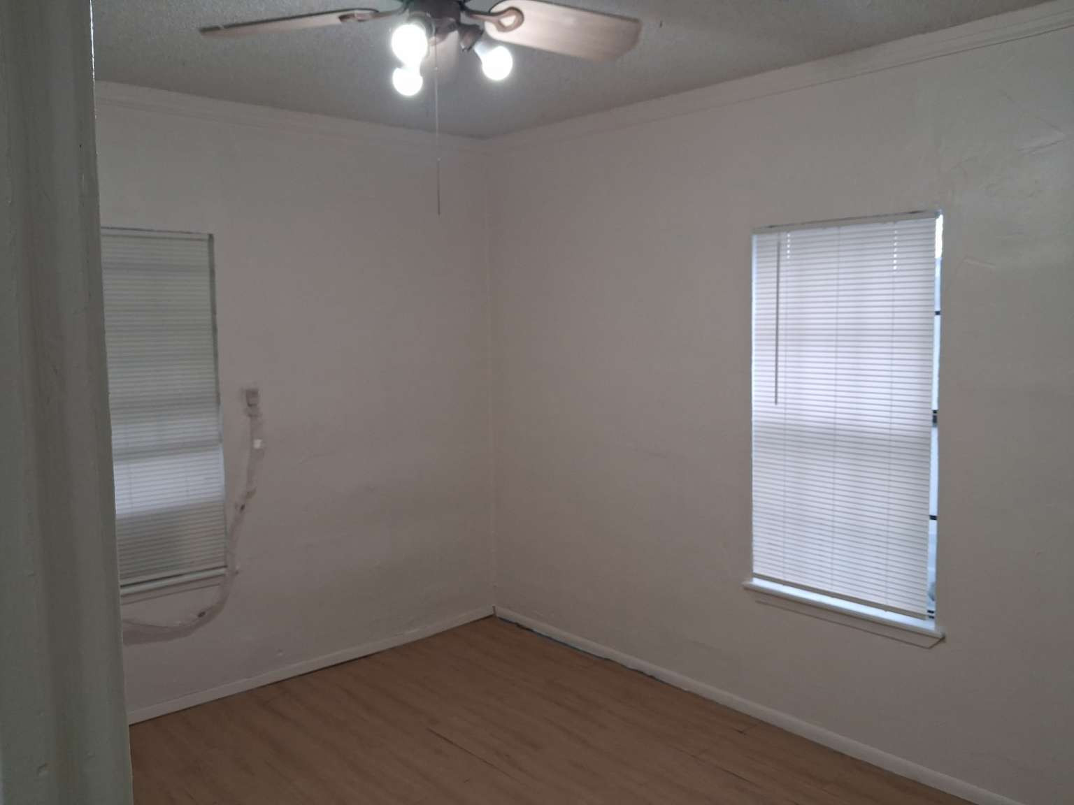 308 North Ridge Street Lampasas, TX 76550 - Photo 12 of 16 an empty room with a window