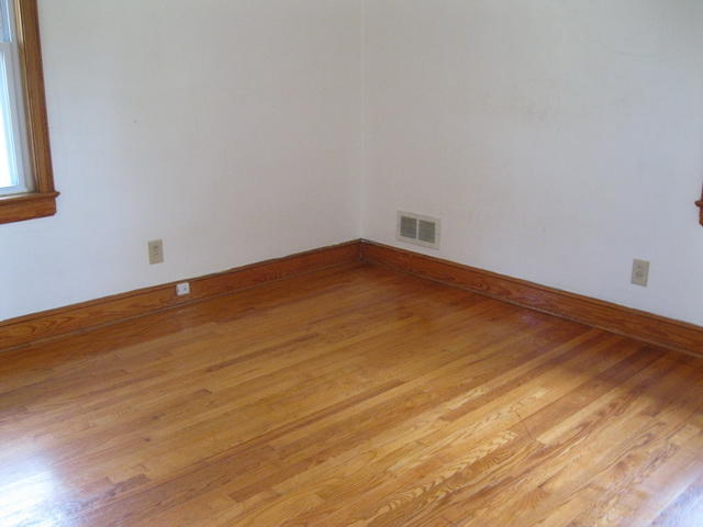 2147 Meadowbrook Road Northwest Roanoke, VA 24017 - Photo 14 of 17 a view of empty room with wooden floor and fan
