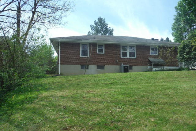 2147 Meadowbrook Road Northwest Roanoke, VA 24017 - Photo 3 of 17 a front view of a house with a garden