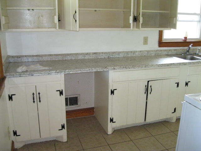 2147 Meadowbrook Road Northwest Roanoke, VA 24017 - Photo 5 of 17 a view of a kitchen with white cabinets and a sink