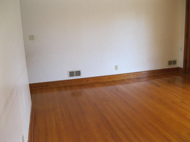 2147 Meadowbrook Road Northwest Roanoke, VA 24017 - Photo 7 of 17 an empty room with wooden floor