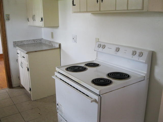 2147 Meadowbrook Road Northwest Roanoke, VA 24017 - Photo 8 of 17 a kitchen with a stove and a refrigerator