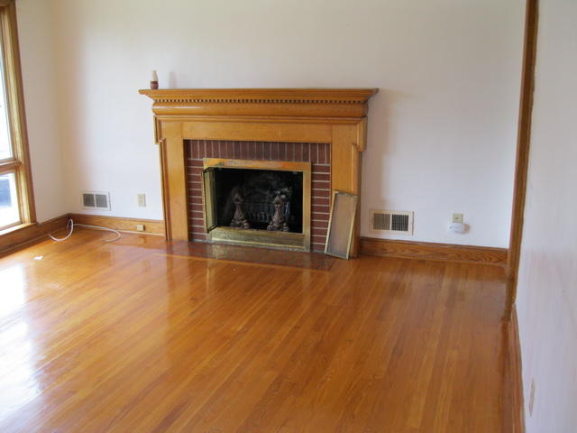 2147 Meadowbrook Road Northwest Roanoke, VA 24017 - Photo 10 of 17 a view of an empty room with wooden floor fireplace and a window