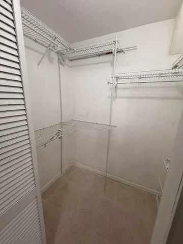 a bathroom with a sink vanity mirror and toilet