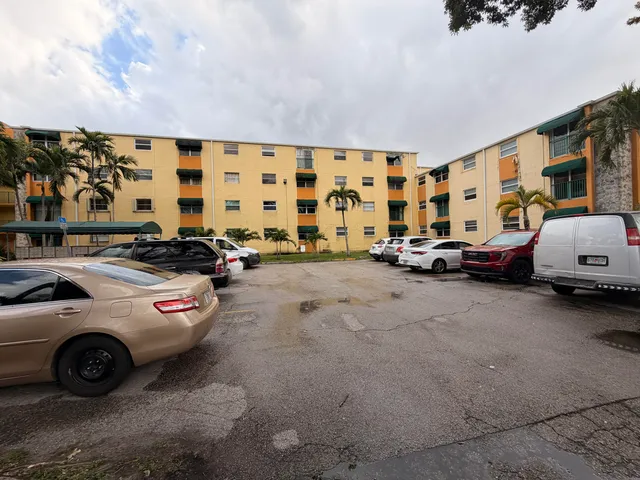 a view of parking with cars parked