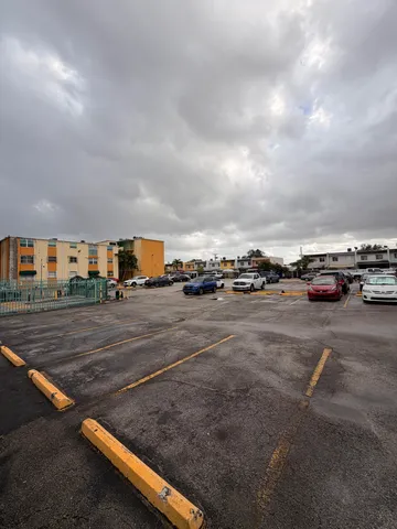 a view of a cars park in front of it