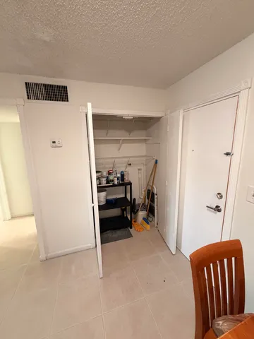 a view of a livingroom with furniture and front door