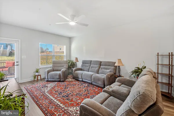 a living room with furniture and a rug