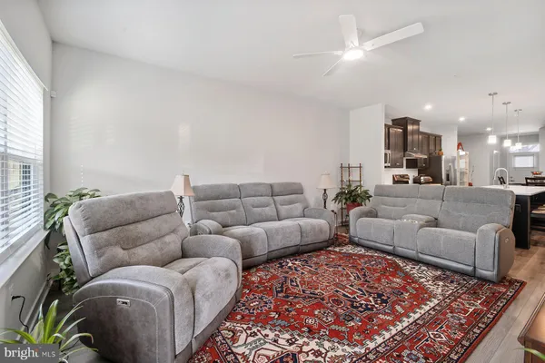 a living room with furniture and a rug