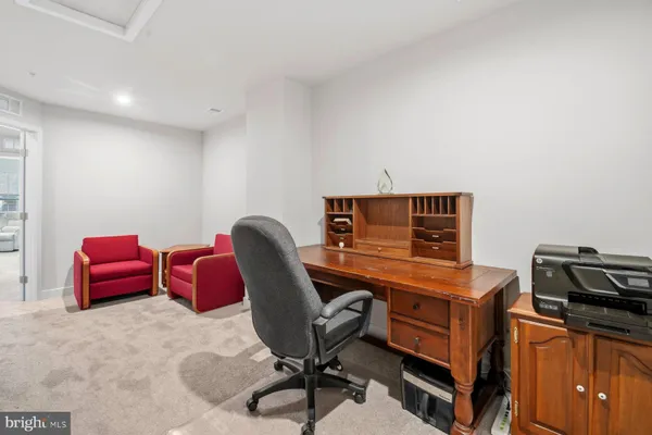 a view of a workspace with furniture