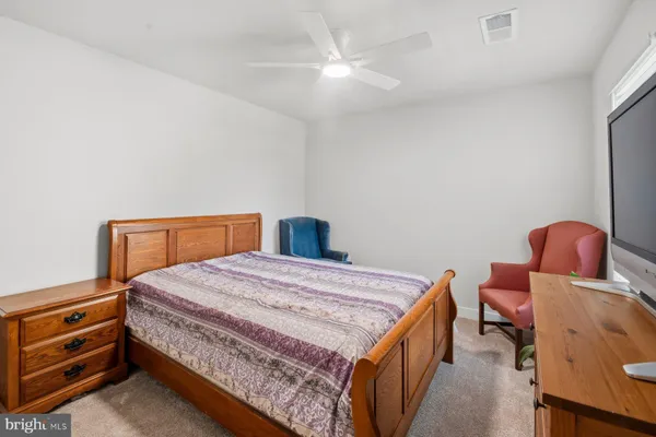 a bedroom with a bed and furniture