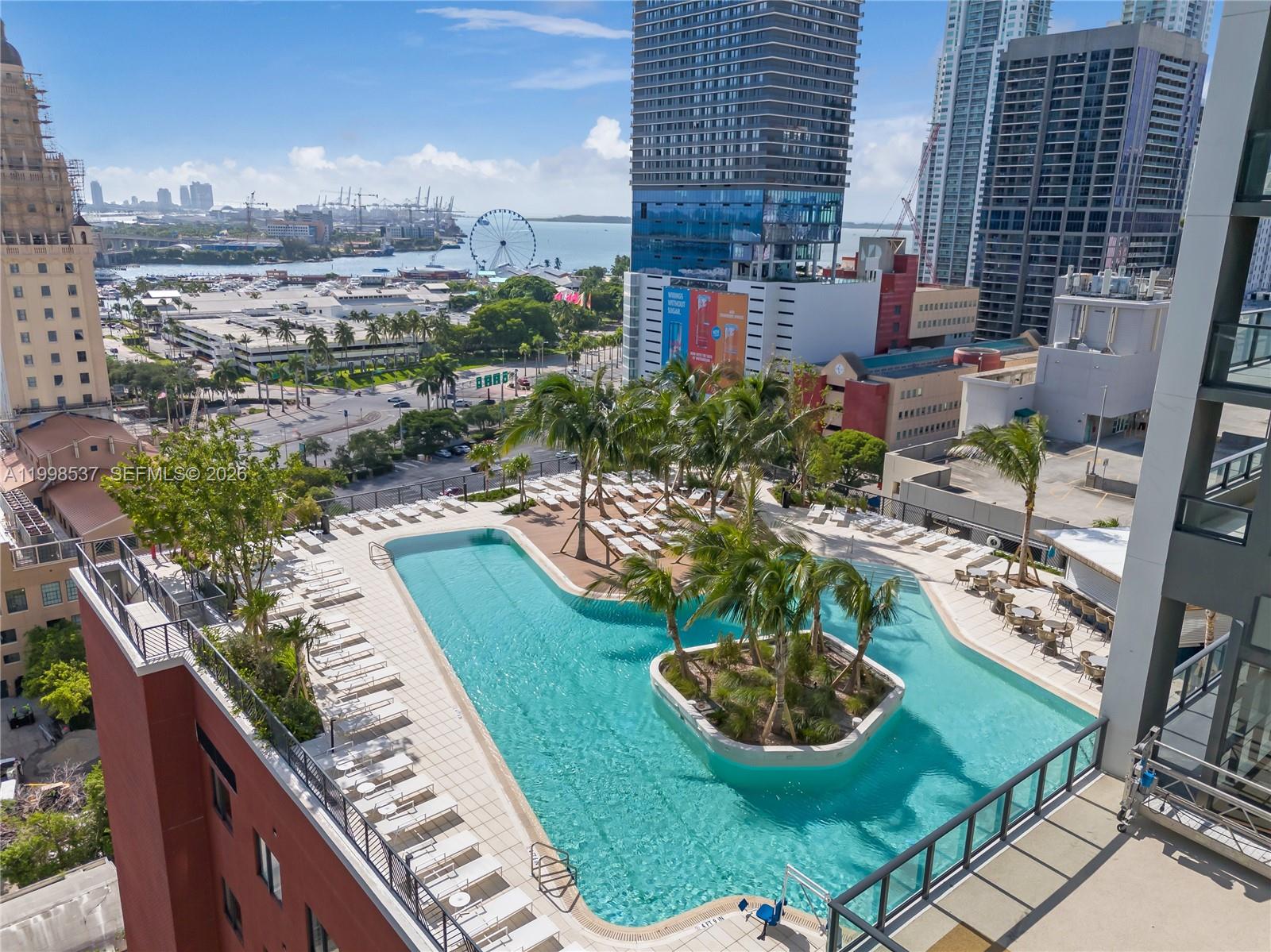 159 Northeast 6th Street, Unit 2403 Miami, FL 33132 - Photo 2 of 16 a view of a backyard with garden and outdoor seating