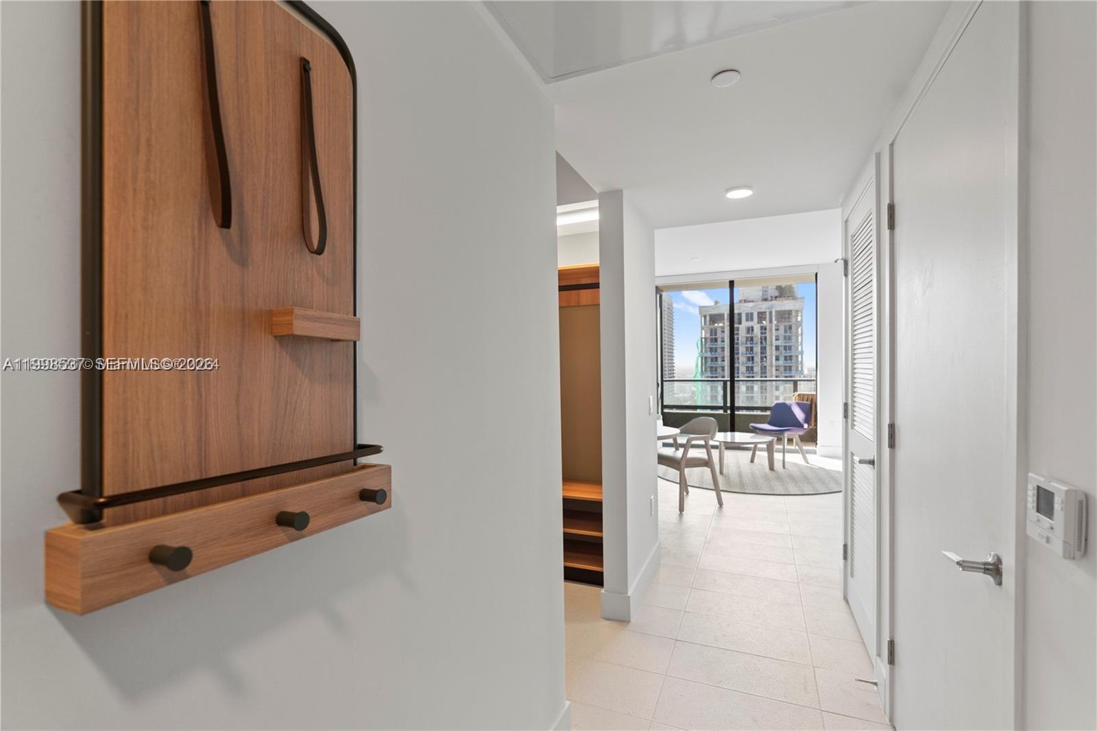 159 Northeast 6th Street, Unit 2403 Miami, FL 33132 - Photo 6 of 16 wooden floor with a bathroom