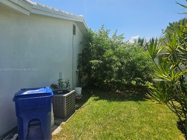 a backyard of a house with lots of green space