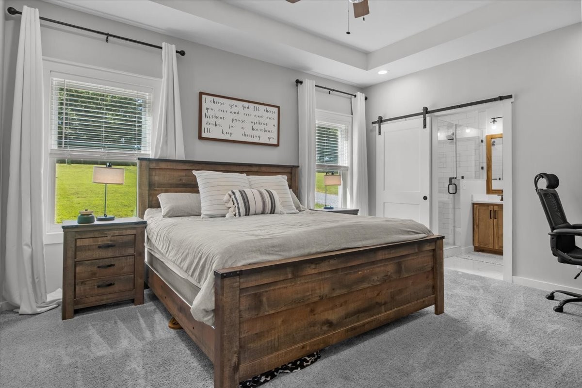 1119 Gallion Road Cumberland Furnace, TN 37051 - Photo 21 of 32 a spacious bedroom with a bed and a dresser