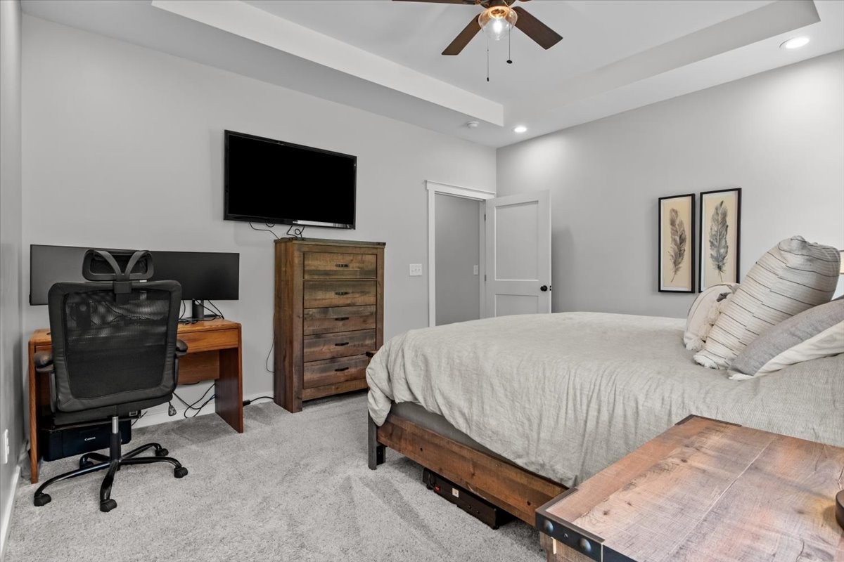1119 Gallion Road Cumberland Furnace, TN 37051 - Photo 22 of 32 a bedroom with a bed and a flat tv screen on a dresser