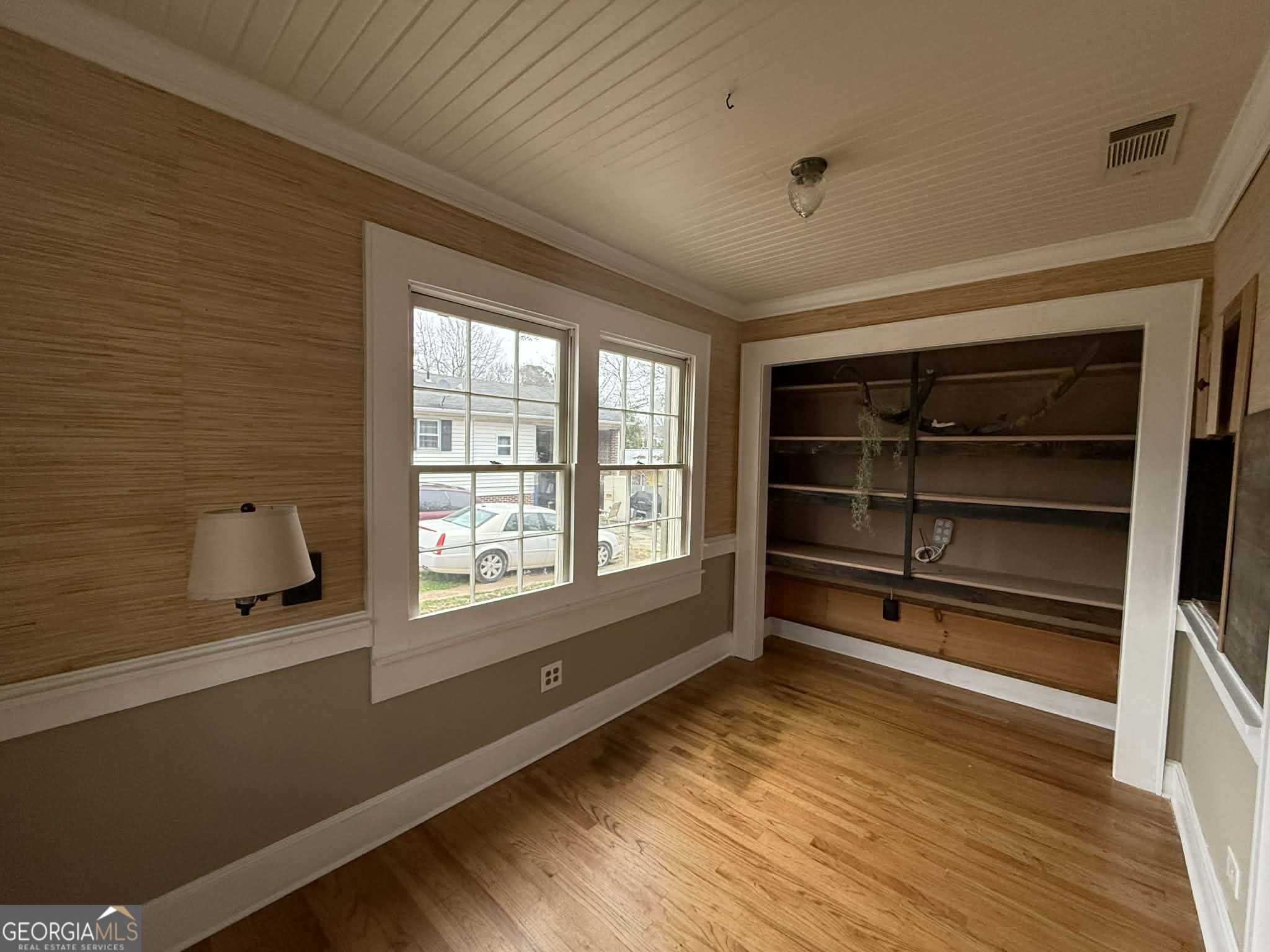952 Wayside Street Northwest Cornelia, GA 30531 - Photo 11 of 46 a view of an empty room with a window and wooden floor