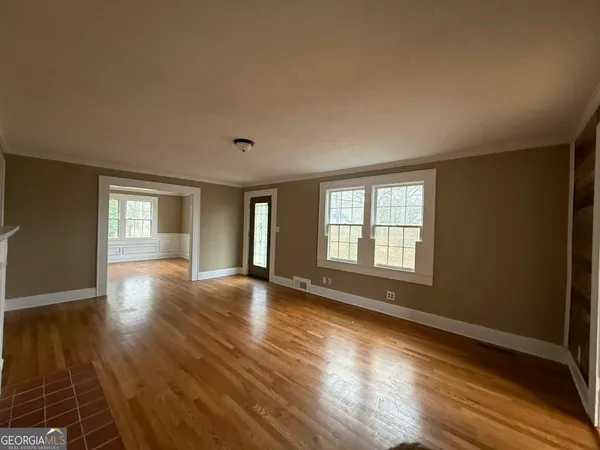 a view of livingroom with hardwood floor and window
