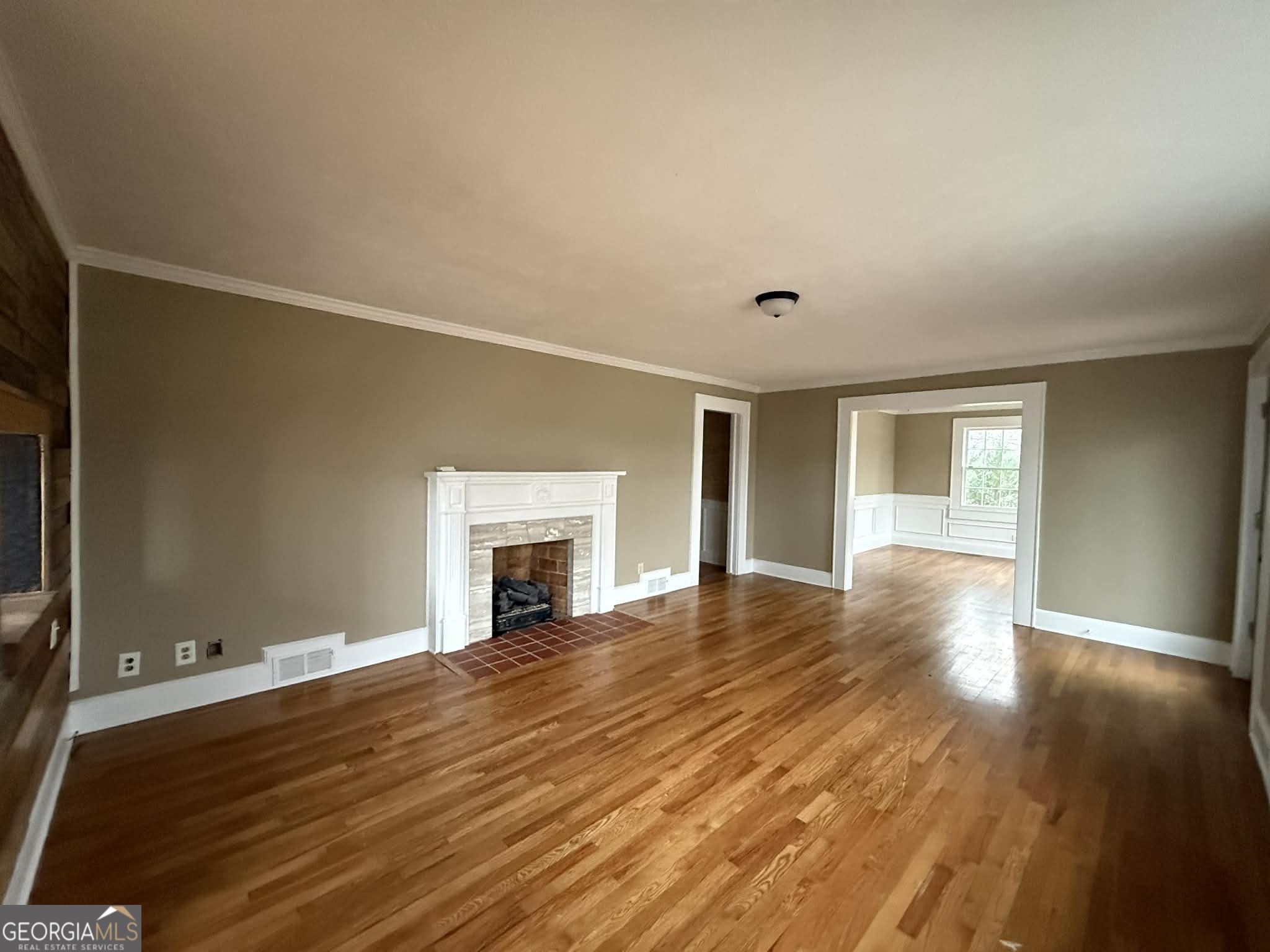 952 Wayside Street Northwest Cornelia, GA 30531 - Photo 13 of 46 a view of empty room with wooden floor and fireplace