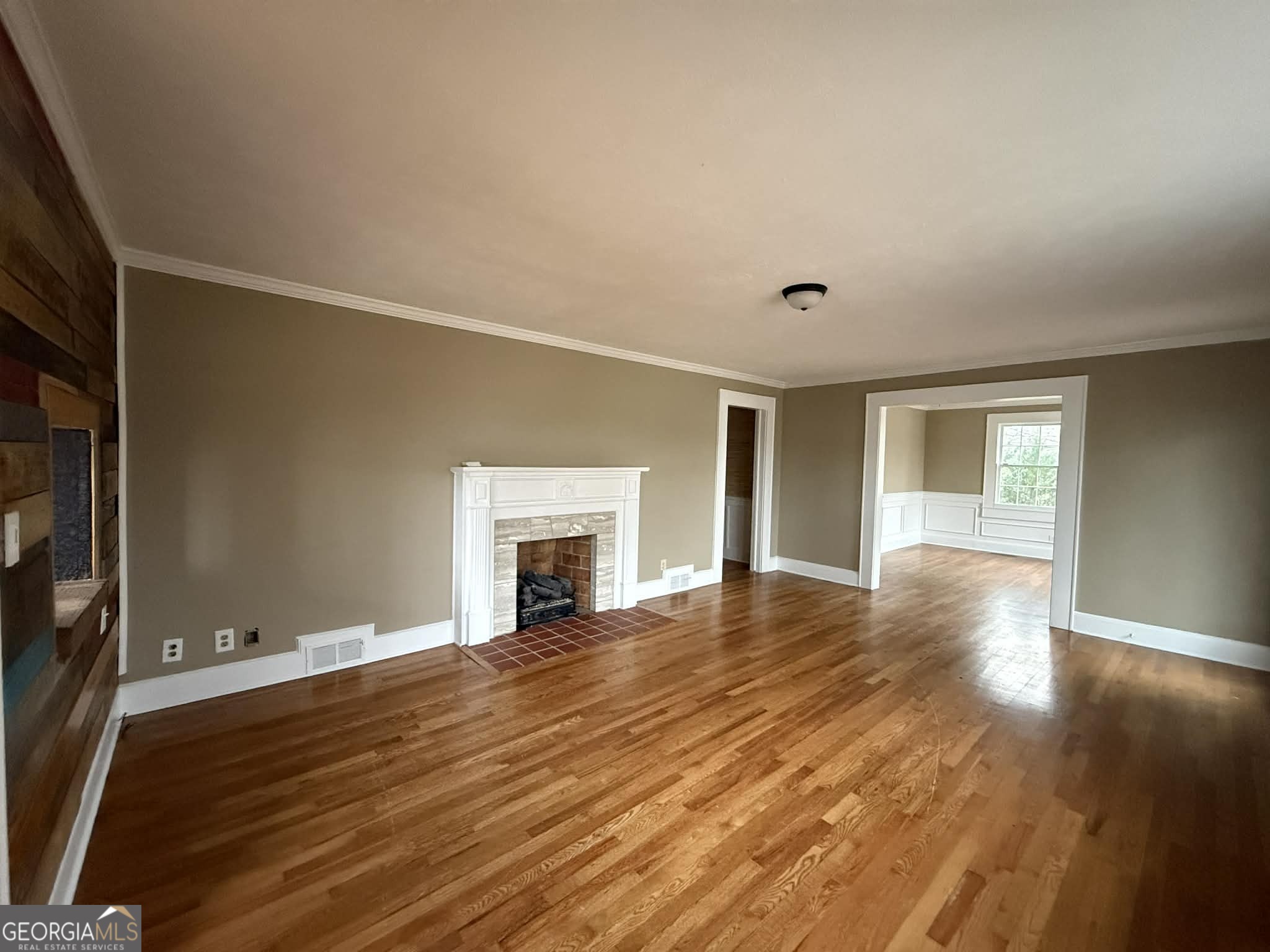 952 Wayside Street Northwest Cornelia, GA 30531 - Photo 18 of 46 a view of empty room with wooden floor and fireplace